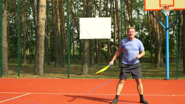 Disappointed Male Tennis Player After Missing Shot