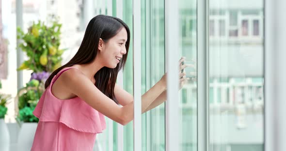 Young Woman use of smart phone inside shopping center