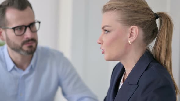 Close Up of Businesswoman Talking to Businessman