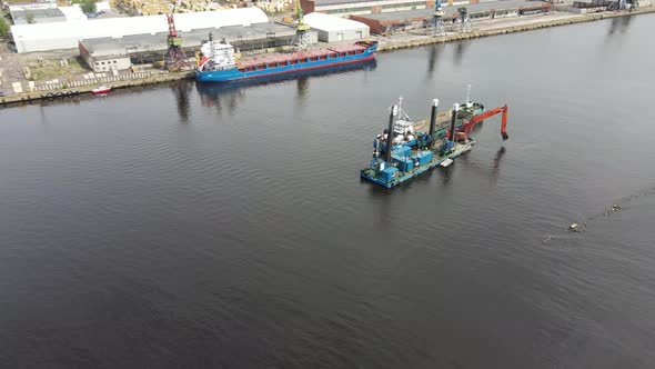 Cargo ships and the river