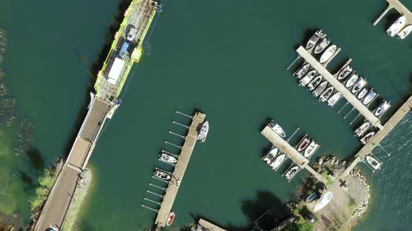 Aerial top down, drone shot above a cable ferry and a harbor, in the archipelago of Porvoo, sunny, s