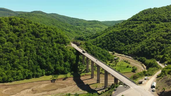 Bridge In Caucasus With Truck And Greenery Around