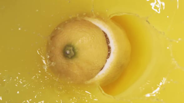 Lemon Falling on Juice and Divided in Half