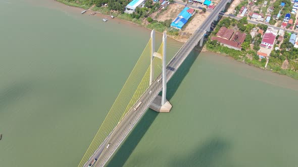 Traffic At Neak Loeung Bridge Over Mekong River In Cambodia. aerial drone