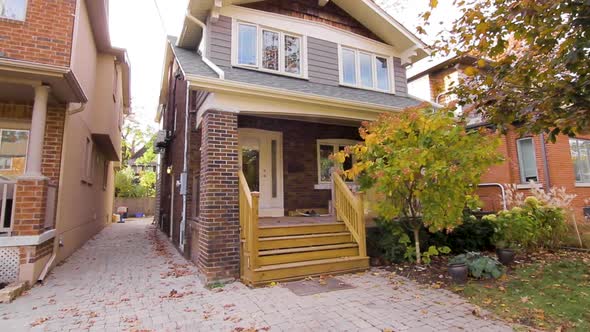 Exterior of beautiful brick home on a sunny Summer day.