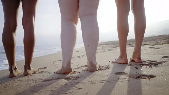 young women having fun on the beach