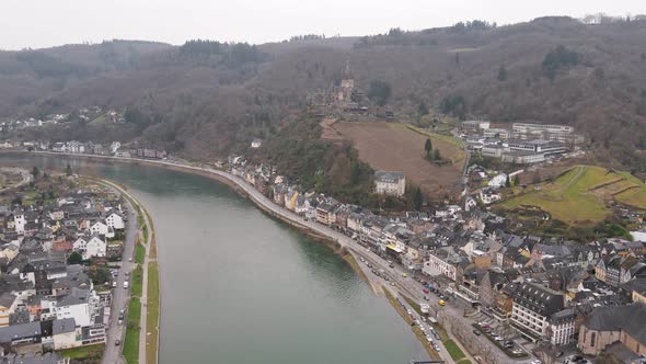 drone flight over the Moselle river through Cochem in Germany with the castle in the background