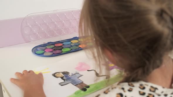 Talented Creative Child Girl Female Artist Draws with Her Hands on Paper Using Fingers Paints Brush