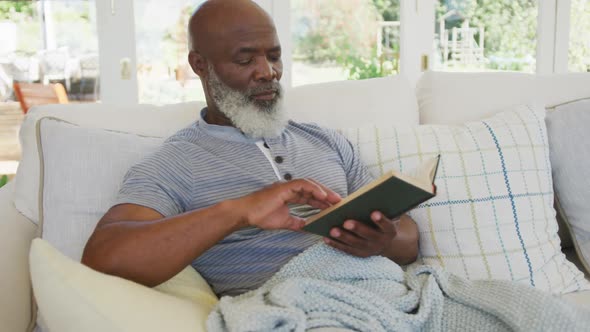 Senior african american man reading book