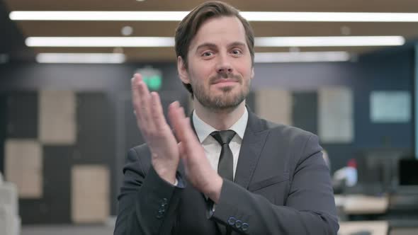 Portrait Shot of Happy Businessman Clapping Applauding