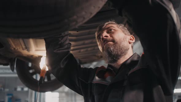 Male Auto Mechanic Making Repairs