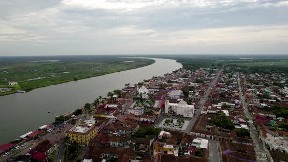 frontal drone shot of the main square and the papaloapan river in tlacotalpan, veracruz, mexico