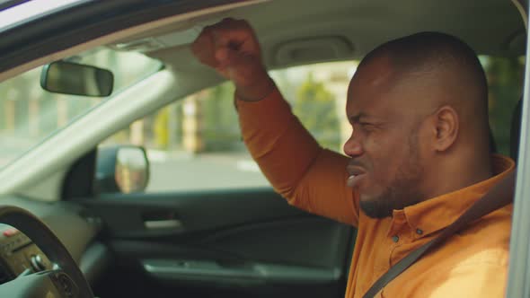 Angry Man Driver Hitting Steering Wheel with Fists