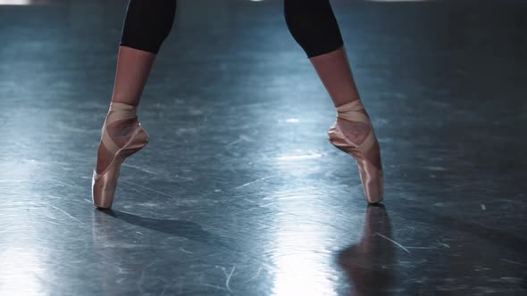 Professional Woman Ballerina Walking on the Tips of Her Pointe Shoes in the Studio
