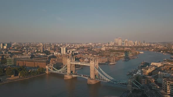 Tower Bridge on Thames River in London at Sunset or Sunrise, Aerial tilt up Establishing Shot of Cit