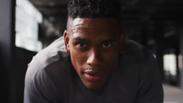 Portrait of african american man taking a break breathing heavily and looking at the camera