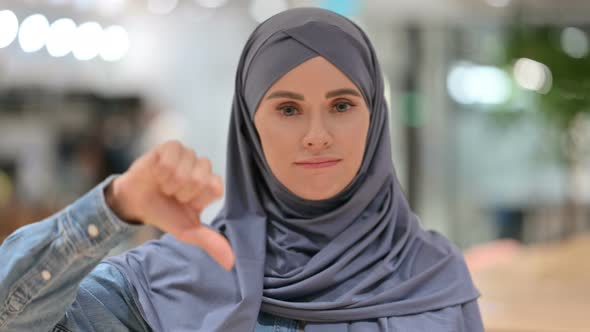 Arab Woman with Thumbs Down Gesture 