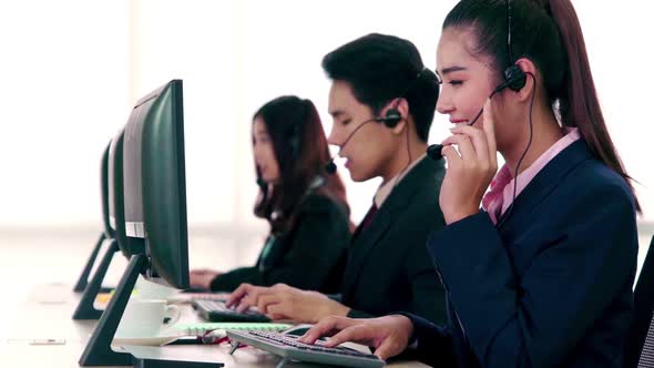 Business People Wearing Headset Working in Office