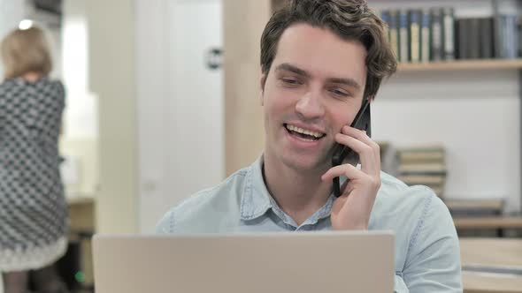 Creative Man Talking on Phone, Discussing Project