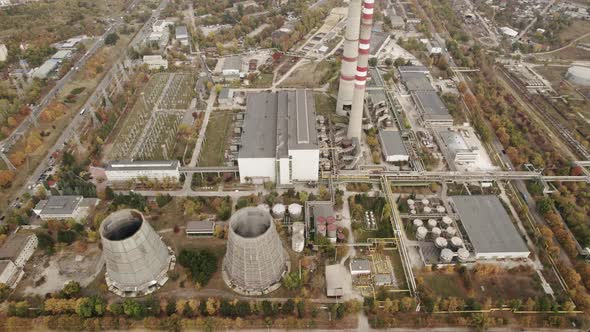 Aerial View of the High Pipes of the Thermal Power Plant Near the Modern City