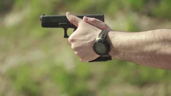 Close-up Shot of a Pistol. Slow Motion.