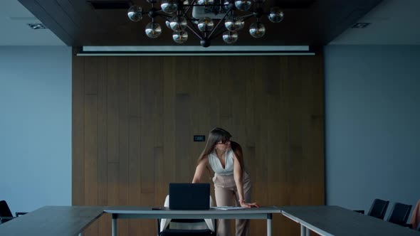 Thoughtful Businesswoman Prepare Presentation on Laptop