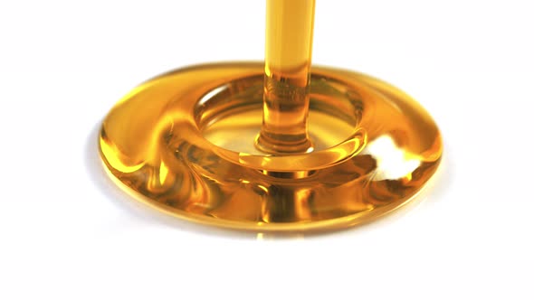 Super Slowmotion Footage of Pouring Golden Oil