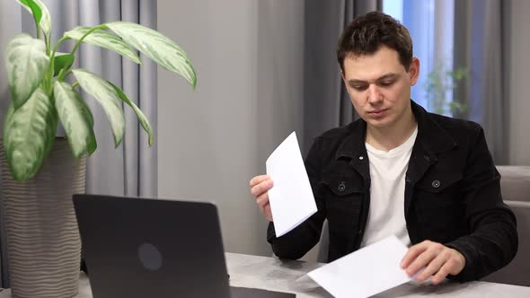 Happy Man at Home Reads Mail About College Admissions Rejoices Victory