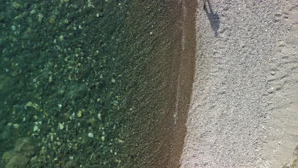 Aerial View on Calm Azure Sea and Volcanic Rocky Shores