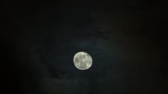 Clouds Passing By Moon at Night