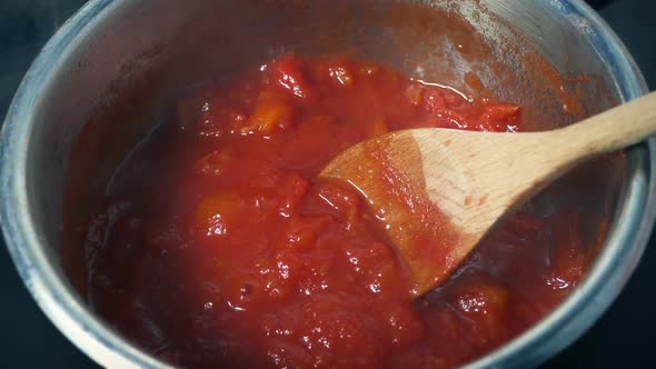 Tomatoes Cooking In Pot And Getting Stirred