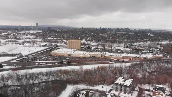 Aerial drone view of bus station in Barrhaven Ottawa Ontario Canada in winter on grey day