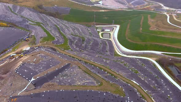 Aerial Flying Over Hillside Landfill In Galicia. Dolly Forward