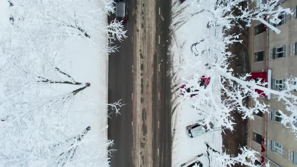 Aerial Top Down View of Snowy City Asphalt Road Landscapes in Winter