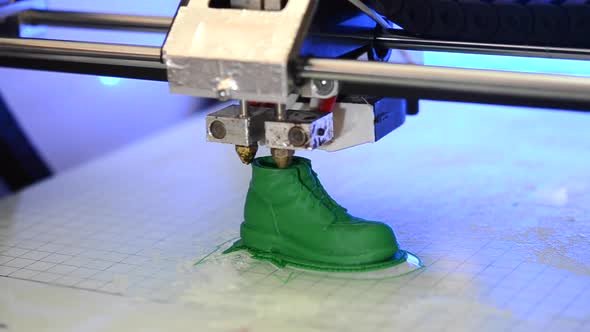 3D Printer Prints the Form of Molten Plastic Green