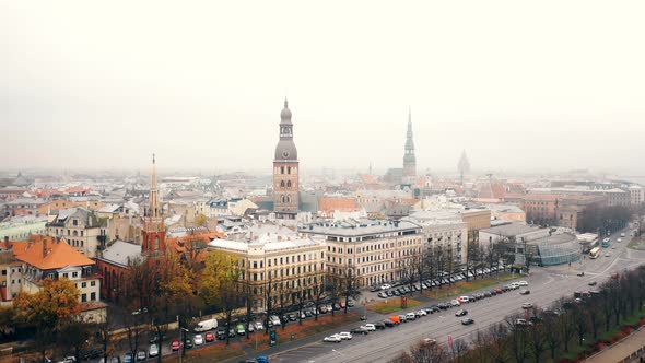 Beautiful Aerial Skyline Panorama of Riga Old Town and Dome Cathedral, Car Traffic at Daugava River