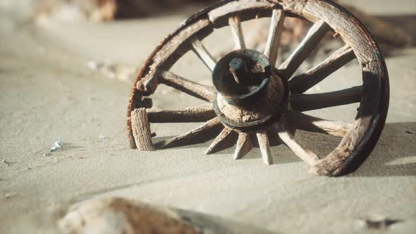 Large Wooden Wheel in the Sand