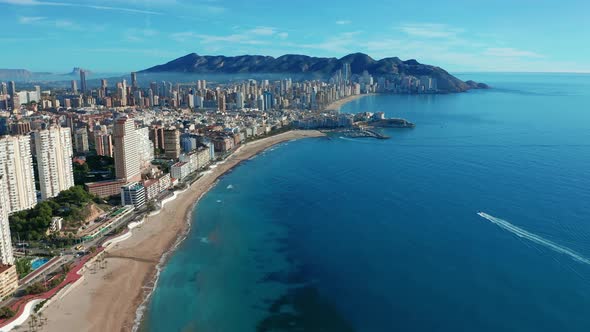 Aerial Footage of Benidorm Playa Levante Beach, Hotels, Buildings, Restaurants and the Coastline and