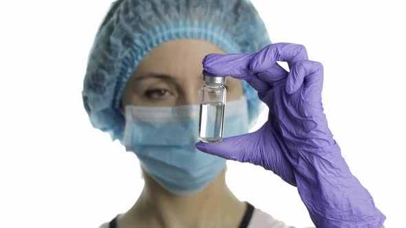 Female Scientist Holding Ampoule in Hand, New Medication Developing, Vaccination