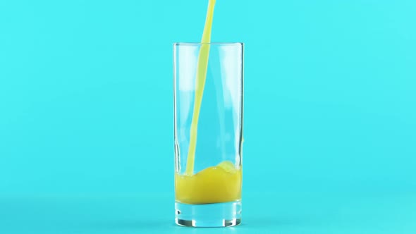 Fruit Orange Multifruit Juice Cold Beverage Drink Pooring Into Glass Blue 