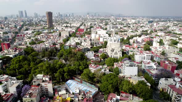 frontal drone shot of main church at south mexico city