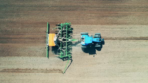 Top View of an Industrial Machine Seeding the Ground