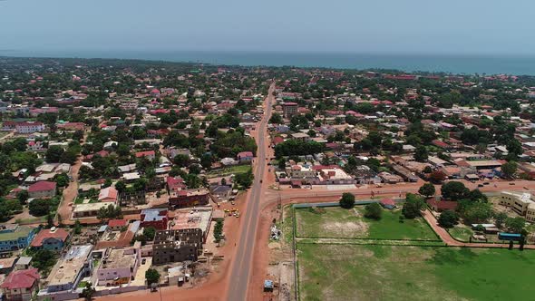 Aerial view over Kololi Road in Bakoteh Serrekunda Gambia Africa towards the North Atlantic Ocean