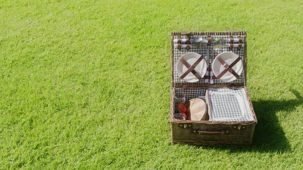 6K Commercial Footage Basket Picnic on Green Grass Background with Copy Space