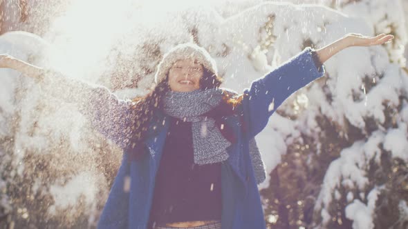 Winter Woman Throwing Snowball, Having Fun Outdoors During Holidays.