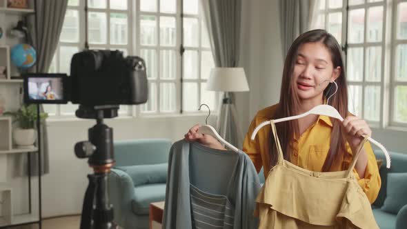 Fashion Blogger Asian Woman Showing Casual Colourful Shirts On Camera