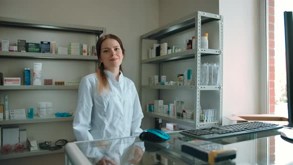 The Girl Pharmacist Checked the Goods and is Ready to Serve Customers