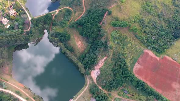 Aerial View of Valley with Lake, Forest and Villa in Tropical Country