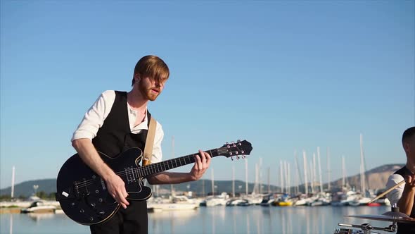 Young Musician Playing Solo Guitar Outdoor