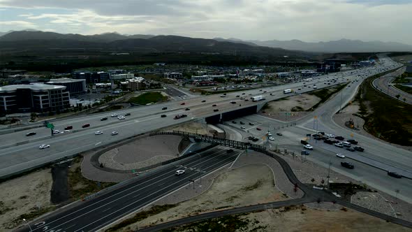 A highway overpass and intersection with moderate traffic in Lehi, Utah by Traverse Mountain